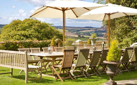The Lost Manor: Furniture, Table, Outdoor Furniture, Chair, Outdoor Table, Lawn, Patio, Kitchen & Dining Room Table, Yard, Garden