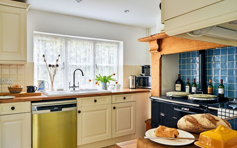 Coachmans Cottage: Kitchen, Kitchen Appliance, Countertop, Cabinetry, Interior Design, Furniture, Major Appliance, Flooring, Drawer, Lighting