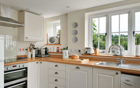 Filspholly: Kitchen, Countertop, Kitchen Appliance, Cabinetry, Interior Design, Furniture, Wood, Flooring, Major Appliance, Home