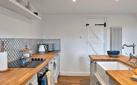 Horseshoe Cottage: Kitchen, Countertop, Kitchen Appliance, Furniture, Flooring, Interior Design, Cabinetry, Wood, Major Appliance, Floor