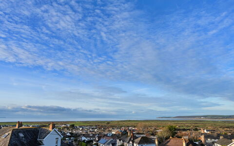 Hillside Rise: Sky, Blue, Daytime, Cloud, Horizon, Residential Area, Roof, Human Settlement, Cumulus, Sunlight