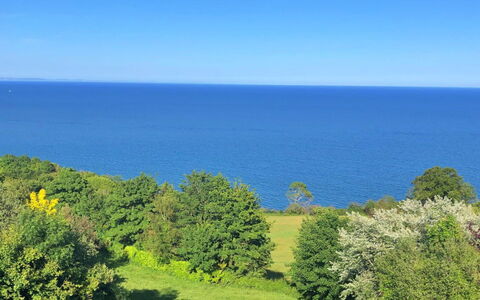 Cliff Lodge: Blue, Sky, Green, Horizon, Vegetation, Natural Landscape, Grassland, Shrub, Sea, Cloud