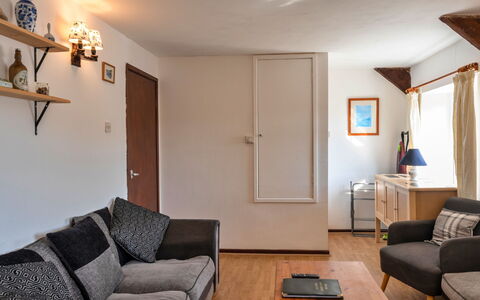 Trimstone Manor - Manor Cottage: Furniture, Interior Design, Wall, Couch, Flooring, Wood, Room, Floor, Ceiling, Living Room