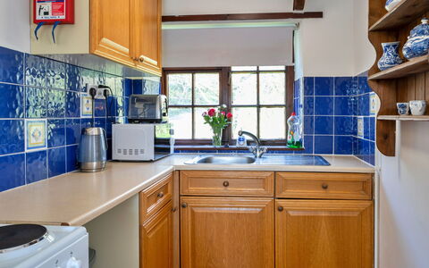 Trimstone Manor - Manor Cottage: Kitchen, Countertop, Wood, Interior Design, Kitchen Appliance, Cabinetry, Flooring, Kitchen Sink, Major Appliance, Plumbing Fixture