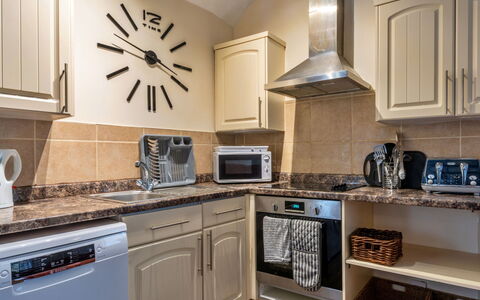 Trimstone Manor - Granary Cottage: Kitchen, Kitchen Appliance, Countertop, Major Appliance, Furniture, Interior Design, Flooring, Kitchen Stove, Cabinetry, Home Appliance
