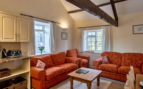 Trimstone Manor - Granary Cottage: Wood, Furniture, Interior Design, Couch, Flooring, Floor, Ceiling, Home, Room, Living Room