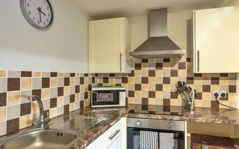 Trimstone Manor - Paddock Cottage: Kitchen, Countertop, Kitchen Appliance, Major Appliance, Flooring, Interior Design, Wood, Cabinetry, Plumbing Fixture, Floor