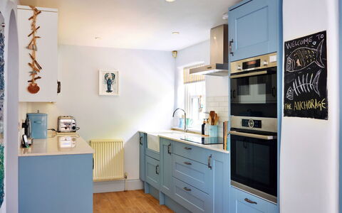 The Anchorage: Kitchen, Kitchen Appliance, Cabinetry, Interior Design, Major Appliance, Countertop, Flooring, Furniture, Wood, Drawer