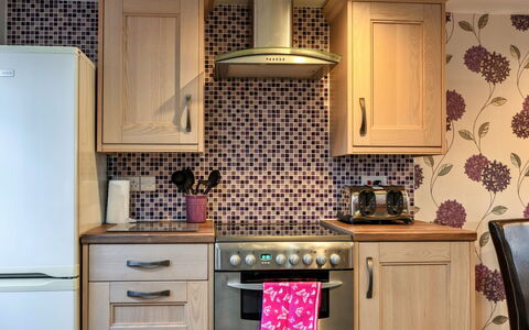 Ivy Cottage, Great Houndbeare Farm: Kitchen, Cabinetry, Major Appliance, Kitchen Appliance, Countertop, Flooring, Interior Design, Furniture, Drawer, Floor