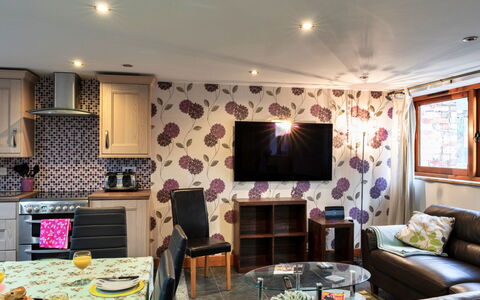 Ivy Cottage, Great Houndbeare Farm: Furniture, Interior Design, Flooring, Room, Ceiling, Floor, Textile, Lighting, Living Room, Table