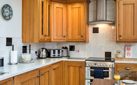 Cob Barn, Great Houndbeare Farm: Kitchen, Countertop, Kitchen Appliance, Cabinetry, Major Appliance, Wood, Interior Design, Flooring, Furniture, Home Appliance