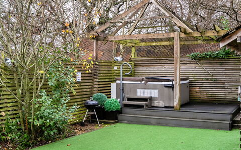 Pig Cottage at Dairy Cottages: Garden, Backyard, Landscaping, Yard, Shade, Courtyard, Outdoor Structure, Artificial Turf, Garden Buildings, Hardwood