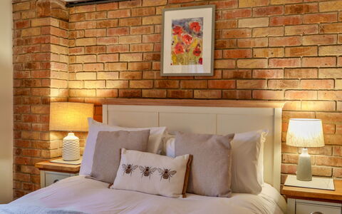 Big Barn at Dairy Cottages: Bed, Bedroom, Wall, Interior Design, Bedding, Wood, Brick, Furniture, Bed Sheet, Throw Pillow