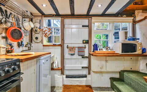 Old Town Cottage, Hastings: Wood, Furniture, Kitchen, Cabinetry, Countertop, Major Appliance, Wood Stain, Hardwood, Drawer, Chair