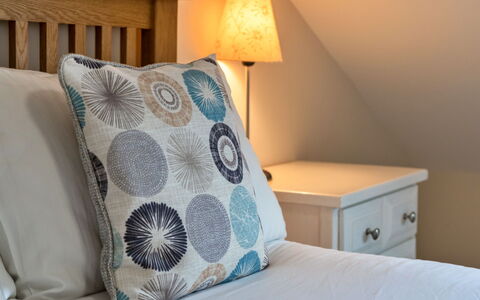 Smugglers Loft at Mixtow Creek: Furniture, Bed, Bedroom, Bedding, Bed Sheet, Linens, Interior Design, Cushion, Throw Pillow, Textile
