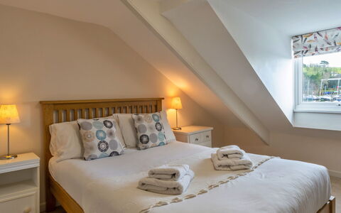 Smugglers Loft at Mixtow Creek: Furniture, Bed, Bedroom, Interior Design, Bedding, Wood, Bed Sheet, Floor, Ceiling, Flooring