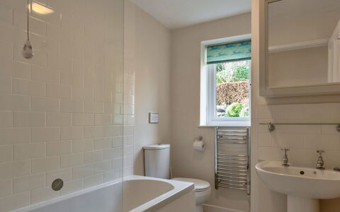 Smugglers Loft at Mixtow Creek: Bathroom, Plumbing Fixture, Wall, Flooring, Bathtub, Floor, Interior Design, Tap, Sink, Bathroom Sink