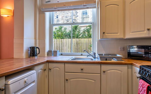 Captain'S Cottage at Mixtow Creek: Kitchen, Kitchen Appliance, Countertop, Interior Design, Major Appliance, Cabinetry, Wood, Flooring, Ceiling, Home Appliance