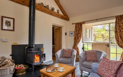 Drovers Retreat: Wood, Furniture, Cottage, Flooring, Hearth, Living Room, Hardwood, Chimney, Chair, Wood-Burning Stove