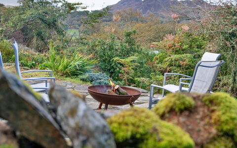 Waen Fechan: Furniture, Outdoor Furniture, Shrub, Plant Community, Garden, Chair, Outdoor Table, Sunlight, Landscaping, Backyard