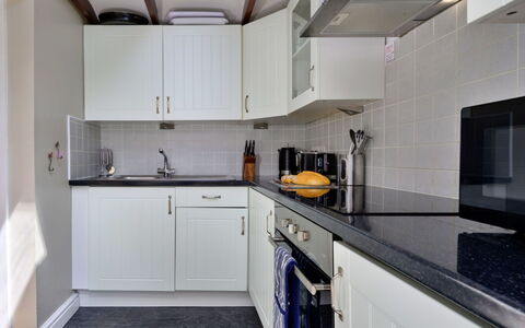 Artro View: Countertop, Kitchen, Kitchen Appliance, Major Appliance, Cabinetry, Plumbing Fixture, Sink, Interior Design, Flooring, Tap