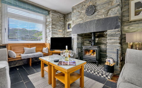 Garreg Ddu: Wood, Furniture, Home, Cottage, Stone Wall, Chair, Living Room, Hardwood, Log Cabin