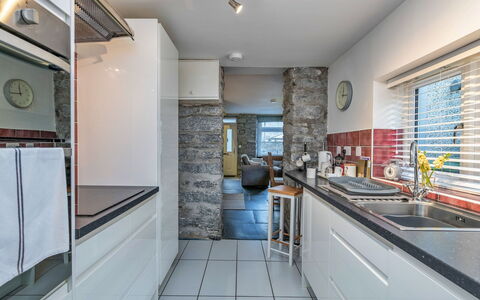 Garreg Ddu: Kitchen, Countertop, Interior Design, Flooring, Kitchen Appliance, Major Appliance, Cabinetry, Ceiling, Floor, Wood