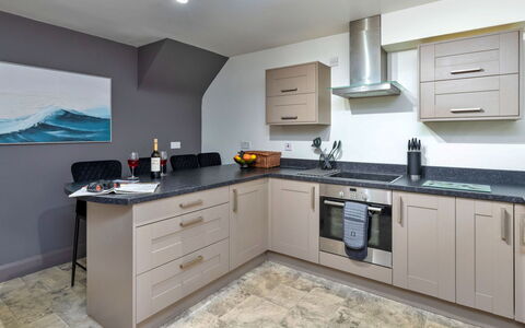 Riverstone Cottage: Kitchen, Countertop, Kitchen Appliance, Major Appliance, Interior Design, Cabinetry, Flooring, Furniture, Wood, Floor