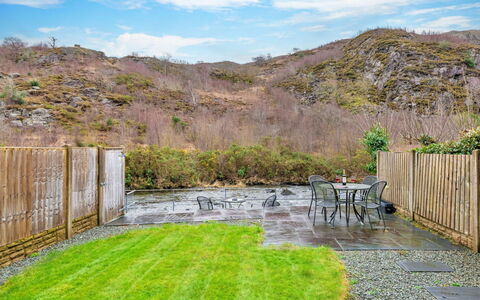 Riverstone Cottage: Garden, Landscaping, Yard, Wood Stain, Hardwood, Backyard, Flagstone, Fence, Eco Hotel, Walkway