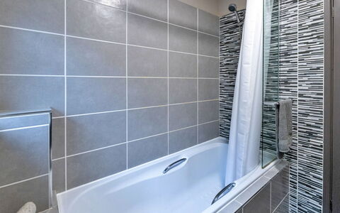 Riverstone Cottage: Flooring, Plumbing Fixture, Floor, Bathtub, Interior Design, Bathroom, Tile, Composite Material, Plumbing, Glass