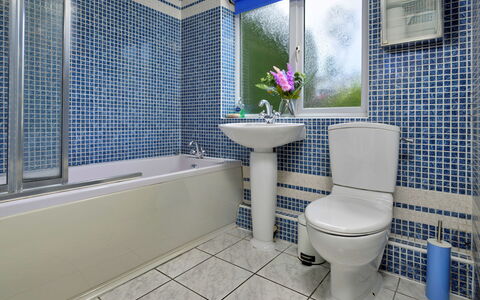 Ty Glan Y Mor: Bathroom, Blue, Plumbing Fixture, Wall, Toilet Seat, Toilet, Flooring, Bathtub, Floor, Interior Design