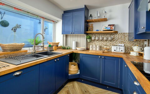 Brigwyn: Kitchen, Cabinetry, Wood, Furniture, Interior Design, Kitchen Appliance, Countertop, Flooring, Lighting, Major Appliance