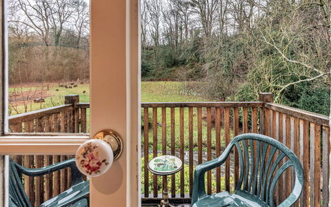 Dolhyfryd Lodge: Wood, Furniture, Wood Stain, Baluster, Hardwood, Chair, Fence, Handrail, Balcony, Deck