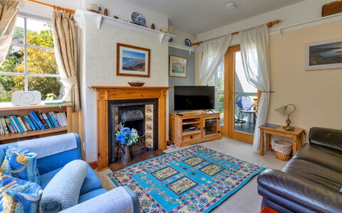 Wern Cottage: Furniture, Wood, Interior Design, Flooring, Table, Floor, Couch, Lighting, Home, Living Room