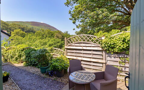 Wern Cottage: Shrub, Garden, Outdoor Furniture, Landscaping, Yard, Chair, Outdoor Table, Houseplant, Backyard, Flowerpot