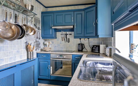 Ty Pen Y Bryn, Castle Views: Blue, Kitchen, Cabinetry, Kitchen Appliance, Countertop, Interior Design, Major Appliance, Furniture, Flooring, Wood
