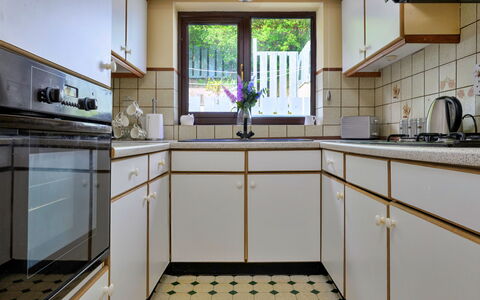 Delfryn: Kitchen, Flooring, Countertop, Interior Design, Kitchen Appliance, Cabinetry, Floor, Major Appliance, Kitchen Stove, Home