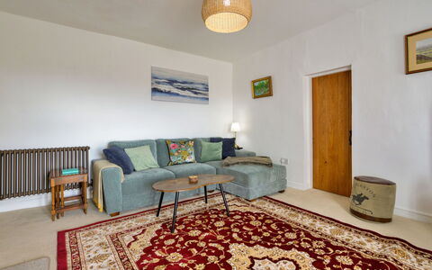 Merddyn Cottage: Furniture, Flooring, Interior Design, Floor, Wall, Couch, Wood, Room, Ceiling, Living Room