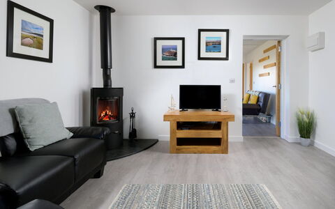 Hedd Wen Cottage: Furniture, Interior Design, Flooring, Wood, Floor, Hearth, Room, Home Appliance, Living Room, Television