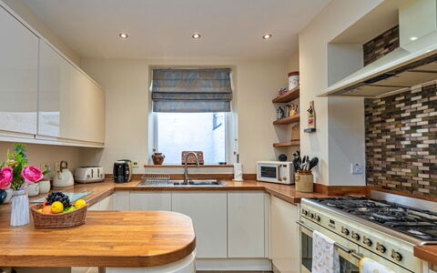 Bryn Derfel House: Countertop, Kitchen, Kitchen Appliance, Interior Design, Major Appliance, Furniture, Cabinetry, Flooring, Wood, Home Appliance