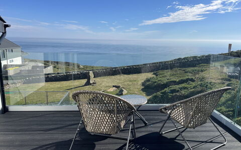 Goferydd: Furniture, Outdoor Furniture, Chair, Sea, Balcony, Coast, Ocean, Shade, Wicker, Daylighting