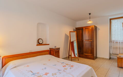 La Finestra sul Lago: Bed, Bedroom, Furniture, Interior Design, Wall, Bed Sheet, Wood, Floor, Bedding, Ceiling