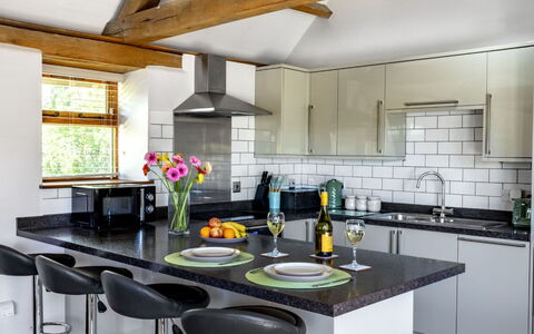 The Cottages Collection at Rusty Lane Farm: Furniture, Kitchen, Interior Design, Countertop, Flooring, Kitchen Appliance, Cabinetry, Light Fixture, Major Appliance, Wood