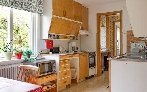 Lantdrömmen: Kitchen, Kitchen Appliance, Major Appliance, Interior Design, Countertop, Furniture, Wood, Flooring, Kitchen Stove, Cabinetry