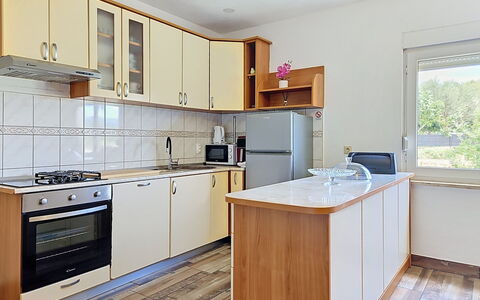 Ivana: Kitchen, Kitchen Appliance, Countertop, Cabinetry, Flooring, Major Appliance, Wood, Interior Design, Furniture, Floor