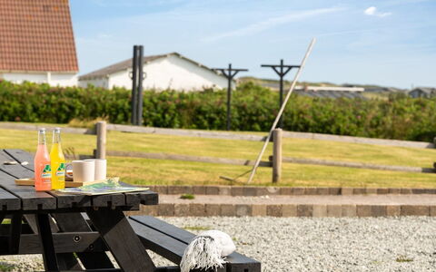 Filine - 100M from the Sea: Sky, Outdoor Furniture, Furniture, Picnic Table, Outdoor Table, Outdoor Bench, Sunlight, Shade, Lawn, Bench