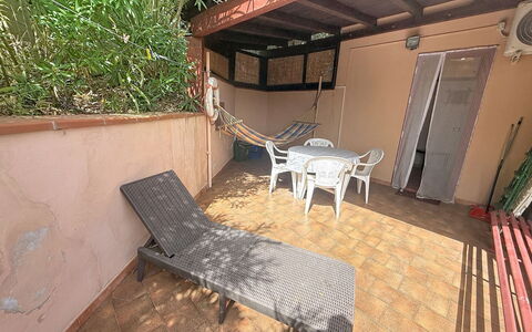 Habitat: Floor, Flooring, Wood Stain, Shade, Backyard, Balcony, Yard, Chair, Outdoor Furniture, Hardwood