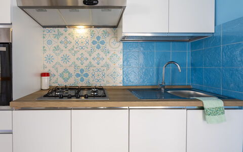 Mariposa: Kitchen, Major Appliance, Flooring, Kitchen Appliance, Countertop, Floor, Kitchen Stove, Stove, Kitchen Sink, Interior Design