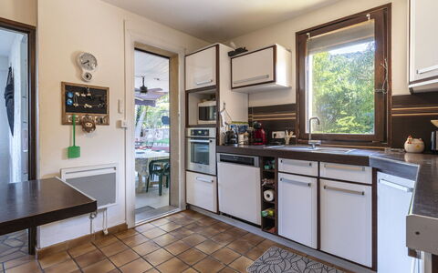 Villa Salario: Kitchen, Countertop, Kitchen Appliance, Furniture, Major Appliance, Interior Design, Wood, Flooring, Cabinetry, Kitchen Stove