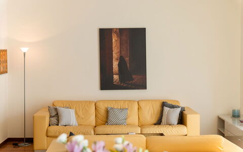 Lory House: Furniture, Wall, Interior Design, Couch, Wood, Yellow, Flooring, Living Room, Floor, Room